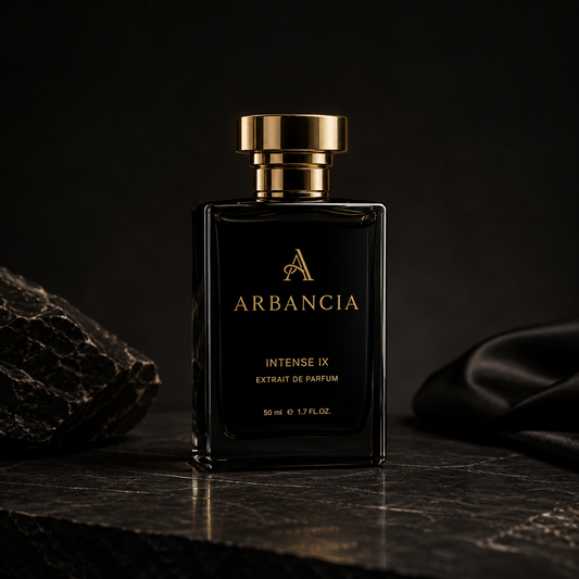 Black perfume bottle with gold cap labeled 'ARBANCIA' on a dark background